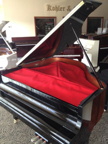 Dawson String cover red on piano